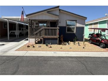 Charming single-wide home with front porch and landscaping at 380 Hilton Head St, Pahrump, NV 89048