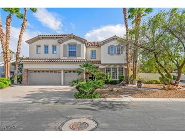 Charming two-story home with a three car garage, landscaped yard, and beautiful curb appeal at 253 White Willow Ave, Las Vegas, NV 89123