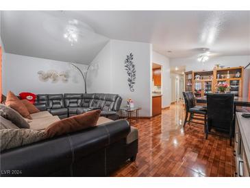 Spacious living room featuring a large sectional sofa and hardwood floors at 4428 Halbert Ave # 0, Las Vegas, NV 89110