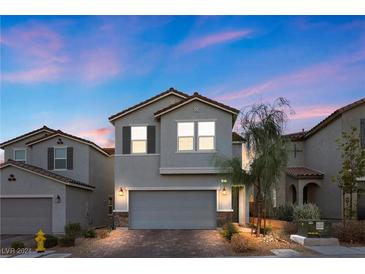 2-story home with gray exterior, 2-car garage, and landscaping at 6957 Antequera St, Las Vegas, NV 89149