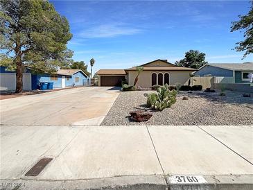 Single story home with a well manicured front yard at 3760 S Torrey Pines Dr, Las Vegas, NV 89103