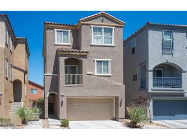 Two story home with attached garage and neutral exterior at 9570 Summer Furnace St, Las Vegas, NV 89178