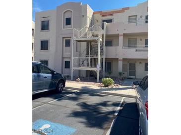 Exterior view of a residential building with stairs and parking at 2004 Mesquite Ln # 201, Laughlin, NV 89029