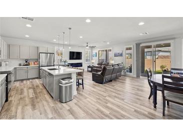 Open floor plan with modern kitchen, island, and spacious living area at 4484 E Cactus Canyon Dr, Pahrump, NV 89061