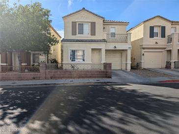 Two story home with attached garage and balcony at 10413 Coyote Cub Ave, Las Vegas, NV 89129