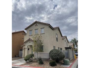 Two-story house with landscaping and a driveway at 10331 Ednor St, Las Vegas, NV 89183