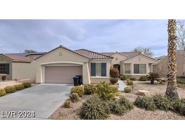 Single-story home with attached garage and well-maintained landscaping at 1652 Black Fox Canyon Rd, Henderson, NV 89052