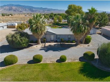 Property situated on a spacious lot with mature landscaping at 3751 Underbrush Ave, Pahrump, NV 89048