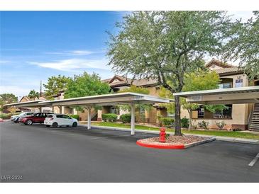 Community parking lot with covered parking spaces at 231 W Horizon Ridge Pkwy # 713, Henderson, NV 89012