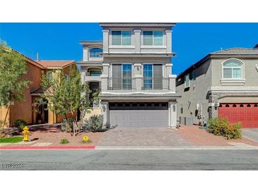 Two-story home with gray siding and a two-car garage at 5960 Aurora Gold Ave, Las Vegas, NV 89141