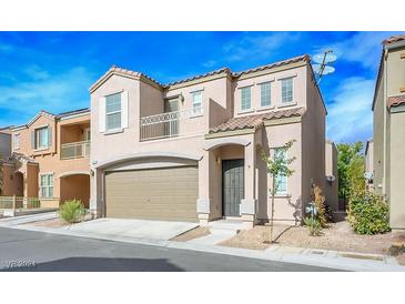 Two-story house with attached garage and balcony at 9094 Hilverson Ave, Las Vegas, NV 89148