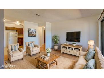 Bright living room featuring a cozy sitting area at 518 Elm St # H, Boulder City, NV 89005