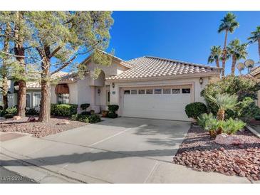 Single story home with two car garage and mature landscaping at 2134 Eaglepath Cir, Henderson, NV 89074