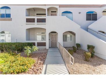 Condo building exterior with walkway and landscaping at 700 Carnegie Street # 2312, Henderson, NV 89052