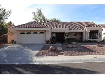 Single-story home with tile roof and two-car garage at 3037 Isaac River Dr, Las Vegas, NV 89134