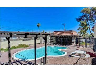 Community pool with pergola and seating area at 1440 Vegas Valley Dr # 6, Las Vegas, NV 89169