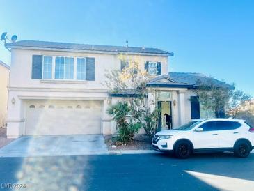 Two-story house with attached garage and landscaping at 8403 Adams Valley St, Las Vegas, NV 89123