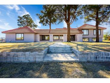 Single story home with tile roof and landscaped yard at 1967 N Moapa Valley Blvd, Logandale, NV 89021