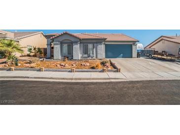 Single-story home with a two-car garage at 2828 Cattail Cove St, Laughlin, NV 89029