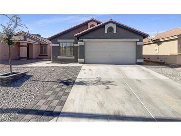 Single-story home with attached garage and paved driveway at 2617 Early Vista St, Las Vegas, NV 89142