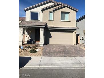 Two-story house with attached garage and landscaping at 3164 Rowan Brook Ave, Henderson, NV 89052