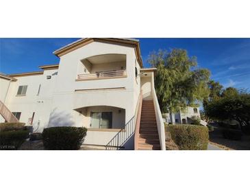 Two-story condo building with stairs and landscaping at 5655 E Sahara Ave # 2031, Las Vegas, NV 89142