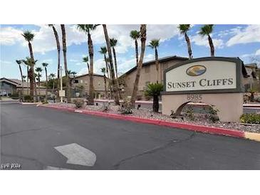 Sunset Cliffs community entrance with palm trees and signage at 8985 S Durango Dr # 2015, Las Vegas, NV 89113