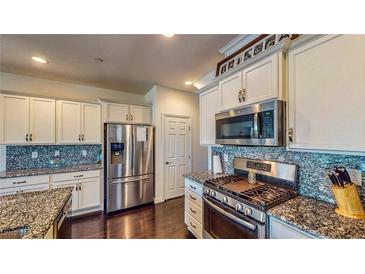 Modern kitchen with stainless steel appliances and granite countertops at 375 Wilford Springs St, Henderson, NV 89014