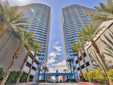 Luxurious highrise building with palm trees and a grand entrance at 4525 Dean Martin Dr # 501, Las Vegas, NV 89103