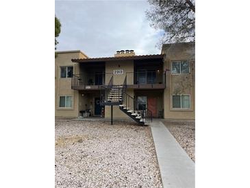 Two-story building with multiple units, balconies, and stairs at 2313 N Jones Blvd, Las Vegas, NV 89108