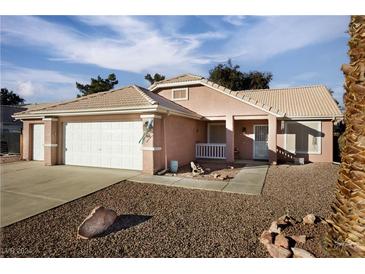 One-story house with two-car garage and landscaped front yard at 553 Eagle St, Mesquite, NV 89027