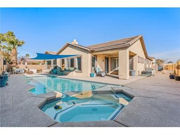 Inviting backyard oasis featuring a sparkling pool and relaxing spa at 10701 La Crescenta Ct, Las Vegas, NV 89141