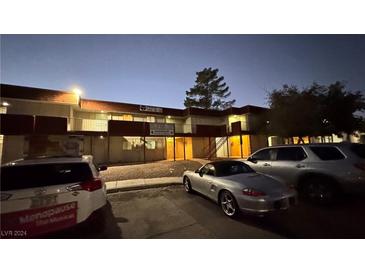 Night view of King Richard Court Condominiums, building 8, showing parking and building exterior at 5324 Swenson St # 0, Las Vegas, NV 89119