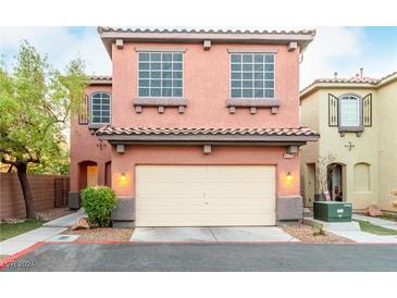 Two-story home with attached garage and landscaped yard at 8905 Cambridge Glen Ct, Las Vegas, NV 89149