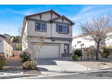 Two-story house with attached garage and landscaping at 4439 Yellow Harbor St, Las Vegas, NV 89129