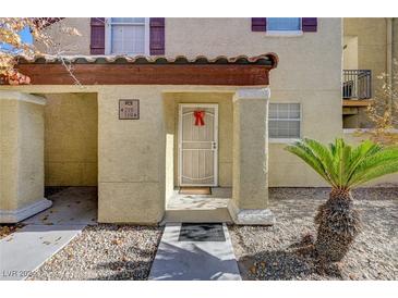 Front entrance of a two-story building with a walkway and landscaping at 2801 N Rainbow Blvd # 119, Las Vegas, NV 89108