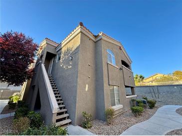 Tan two-story building with stairs and walkway at 5525 W Flamingo Rd # 1018, Las Vegas, NV 89103