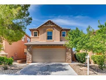 Two-story house with a stone facade and attached garage at 10044 Glen Aire Ave, Las Vegas, NV 89148