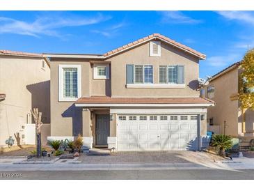 Two-story house with attached garage and landscaping at 7330 Cestrum Rd, Las Vegas, NV 89113