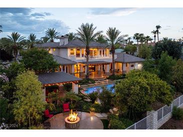 Luxury home with pool, fire pit, and expansive backyard at 2024 Troon Dr, Henderson, NV 89074