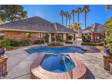 Inviting pool and spa surrounded by a brick patio, offering a relaxing outdoor space at 2508 Rancho Bel Air Dr, Las Vegas, NV 89107