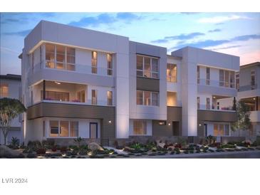 Modern three-story townhome with a sleek design and landscaped grounds at 2486 Indigo Mountain St, Henderson, NV 89044