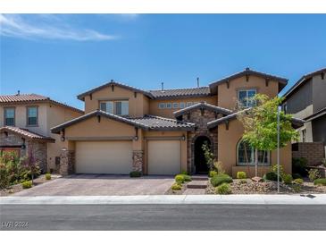 Two-story house with attached garage and landscaped yard at 445 Rosina Vista St, Las Vegas, NV 89138