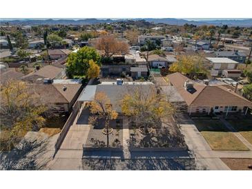 Aerial view of a single story home with a large yard, located in a residential neighborhood at 649 7Th St, Boulder City, NV 89005