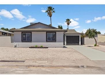 Ranch style home with gray exterior, and gravel landscaping at 5111 Orinda Ave, Las Vegas, NV 89120