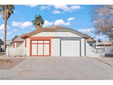 Two-toned house exterior with double garage and landscaping at 5770 Sea Breeze Ave, Las Vegas, NV 89110