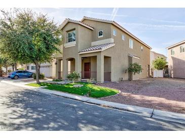 Two-story house with landscaped lawn and attached garage at 5843 Aimless St, Henderson, NV 89011