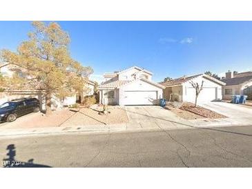 Charming two-story home with a two-car garage, driveway, and front yard at 8428 Lodge Haven St, Las Vegas, NV 89123