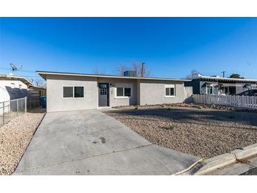 Newly renovated single story home with a landscaped front yard and driveway at 704 Stanford St, Las Vegas, NV 89107