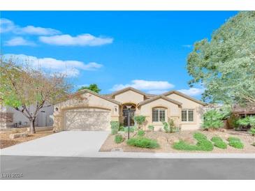 Single-story house with landscaped yard and attached two-car garage at 7832 Red Leaf Dr, Las Vegas, NV 89131